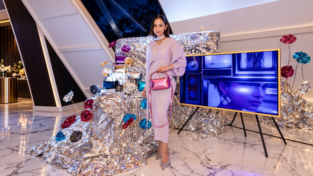 Sculptural silver installation with jewel-toned florals, styled for Ayaaya.